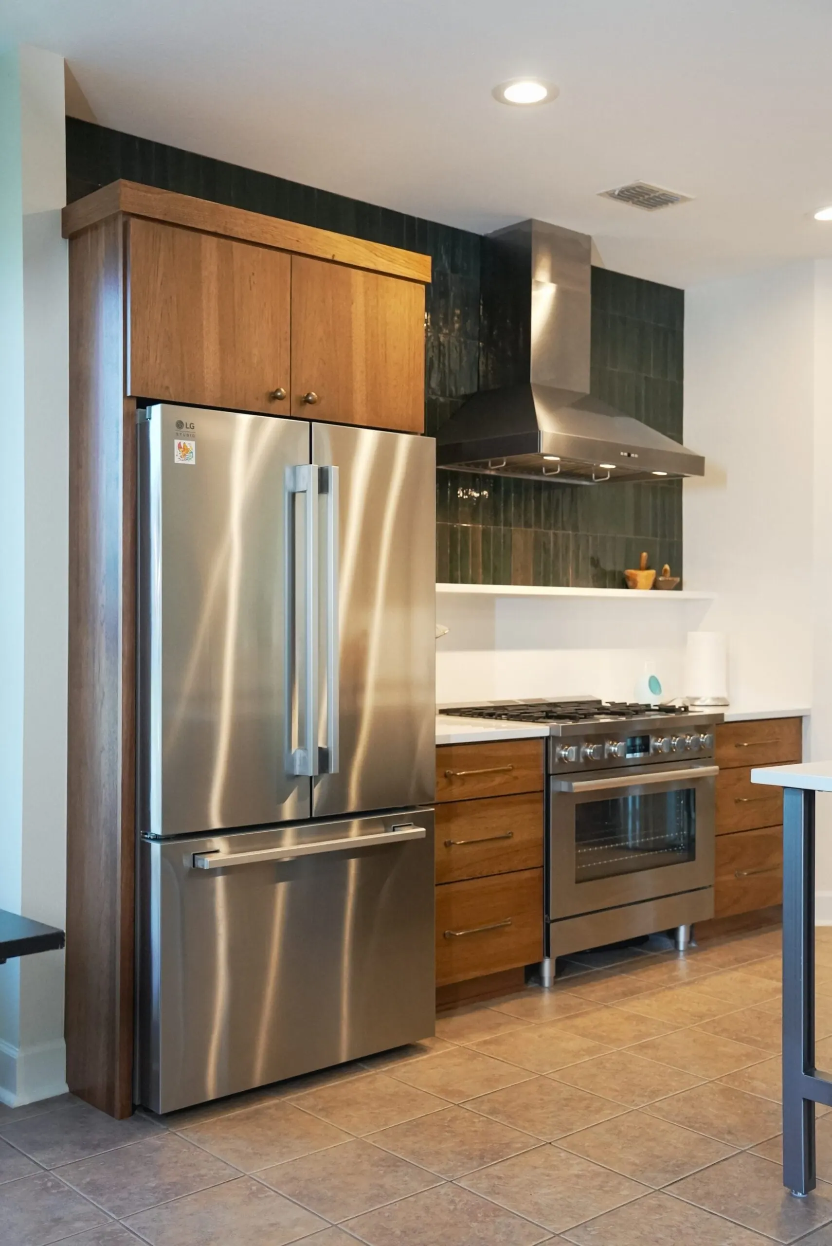 Warm Wood Kitchen With Green Tile And White Counters Kitchen Remodel in Austin, TX by ATX Renovations project photo 7