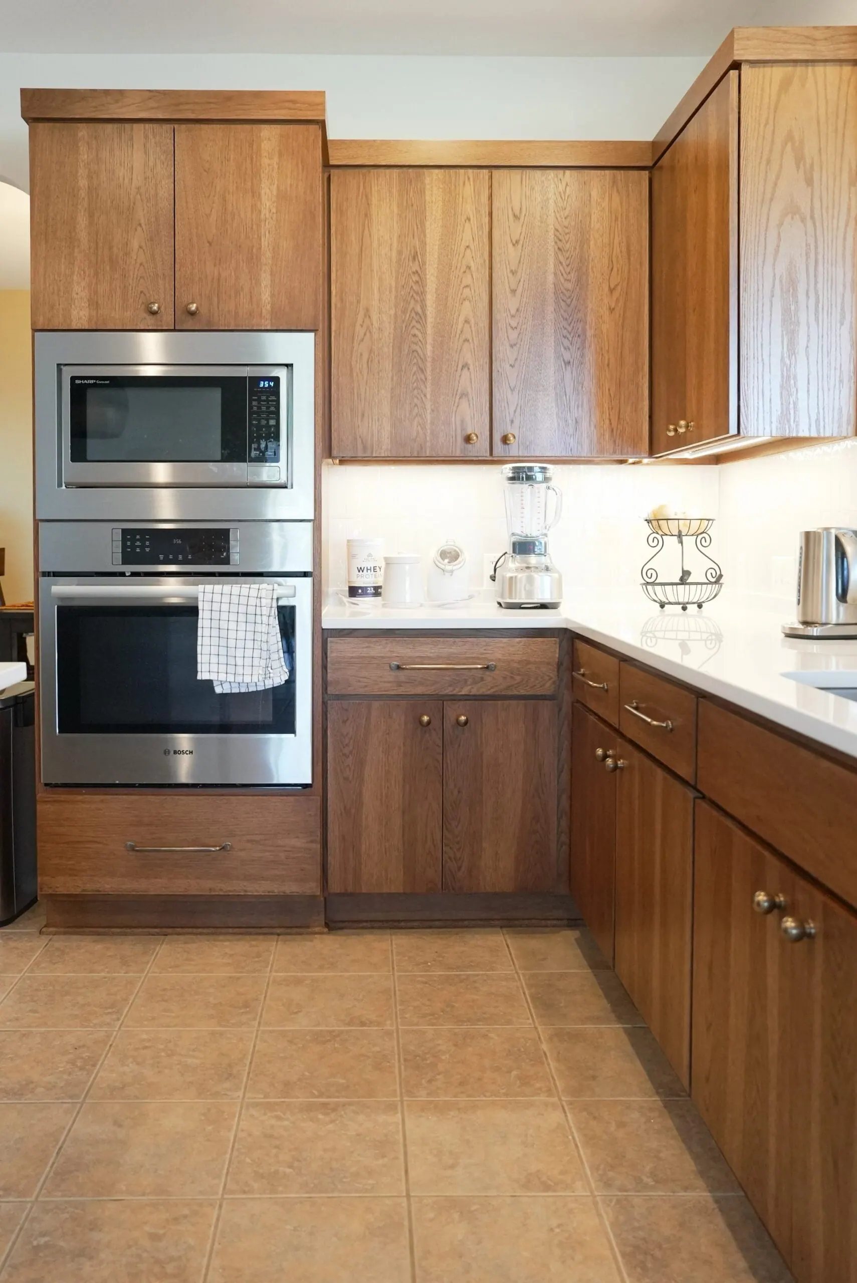 Warm Wood Kitchen With Green Tile And White Counters Kitchen Remodel in Austin, TX by ATX Renovations project photo 6